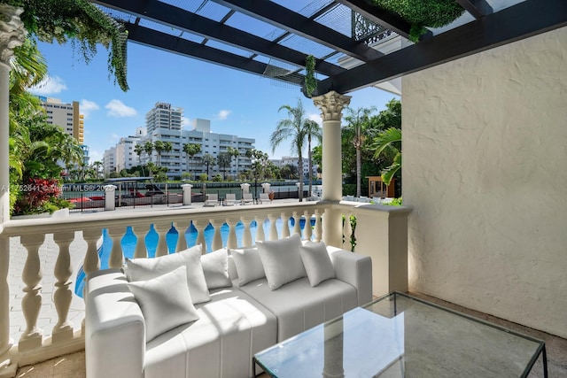 view of patio with a pergola, outdoor lounge area, and a city view