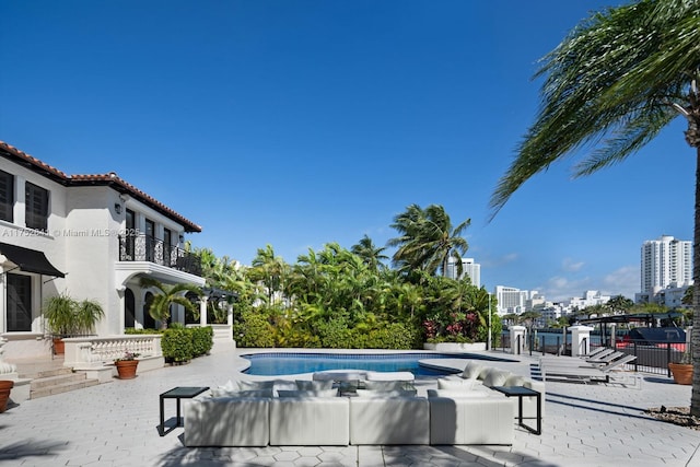 pool featuring a patio and a city view