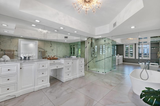 full bath featuring marble finish floor, tile walls, a raised ceiling, visible vents, and a stall shower