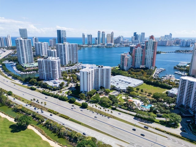 bird's eye view featuring a water view and a city view