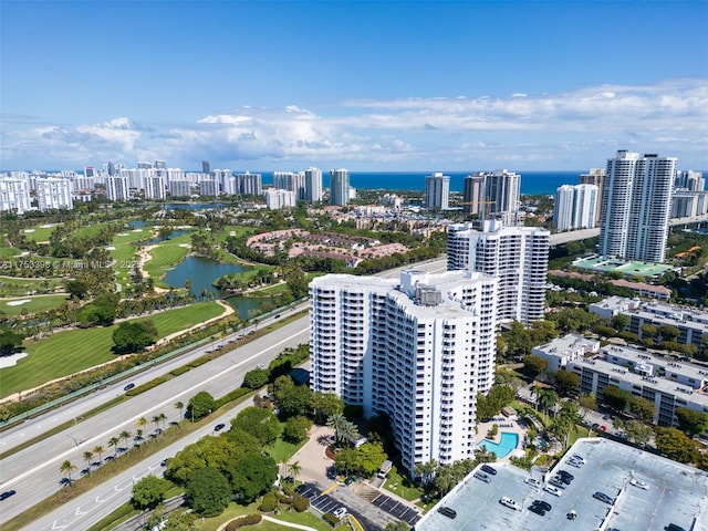 aerial view featuring a view of city and a water view