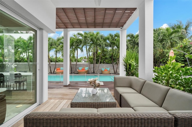 view of patio with outdoor lounge area, fence, a fenced in pool, and a pergola