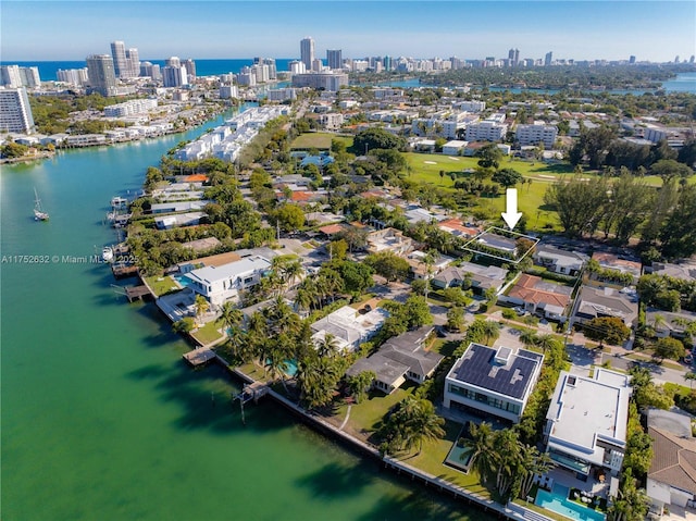 bird's eye view featuring a water view and a city view