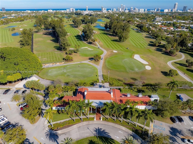 bird's eye view featuring golf course view and a water view