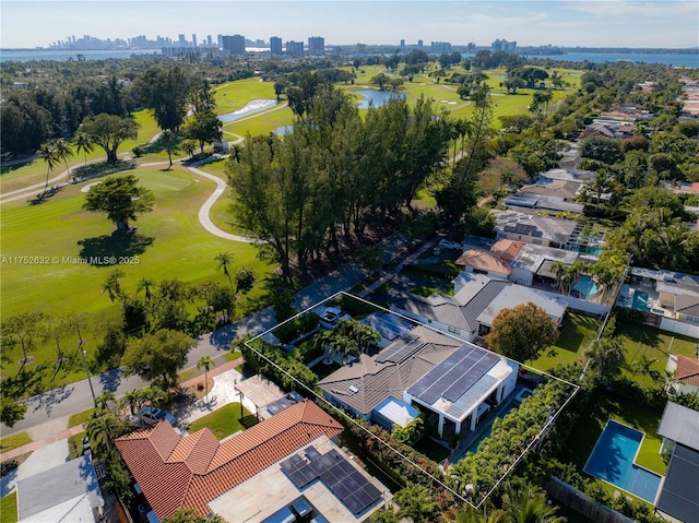 bird's eye view with a water view, a view of city, and golf course view