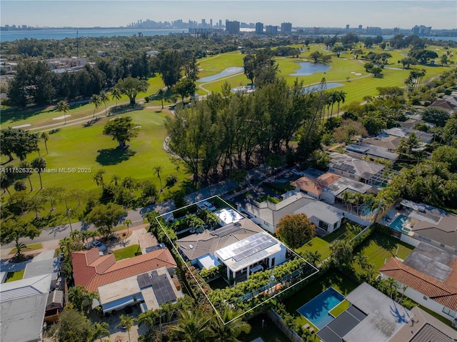 bird's eye view featuring view of golf course and a water view