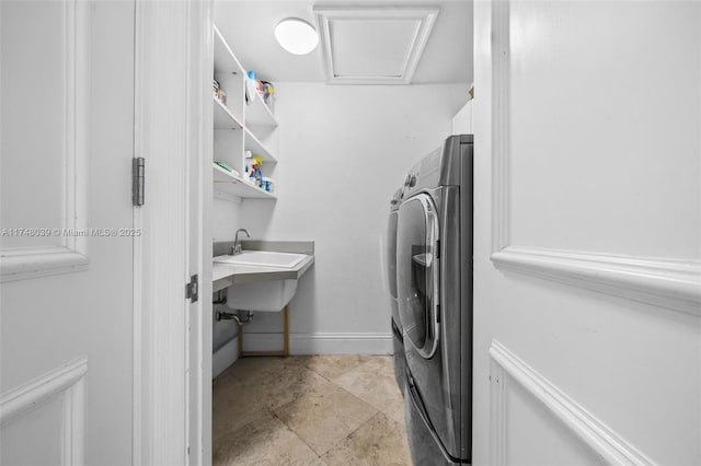 6 Coconut Ln, Key Biscayne, FL 33149 - clothes washing area featuring washing machine and dryer, laundry area, and baseboards