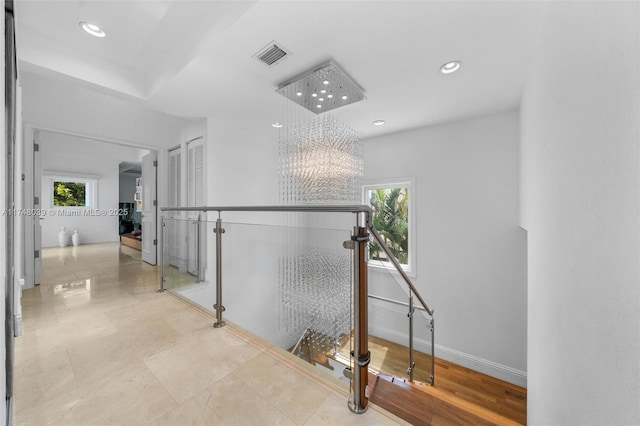6 Coconut Ln, Key Biscayne, FL 33149 - corridor featuring visible vents, recessed lighting, an upstairs landing, baseboards, and a notable chandelier