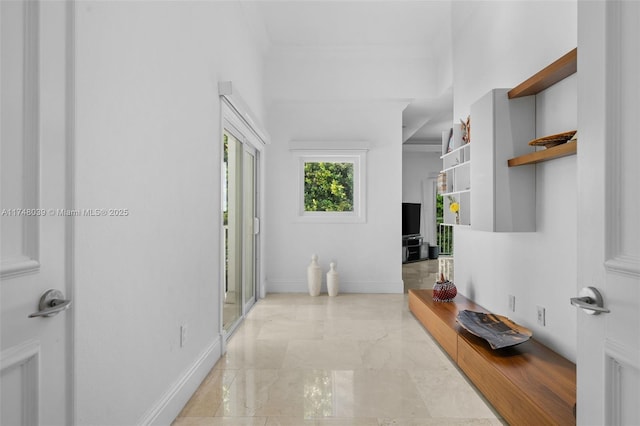 6 Coconut Ln, Key Biscayne, FL 33149 - hallway featuring marble finish floor and baseboards