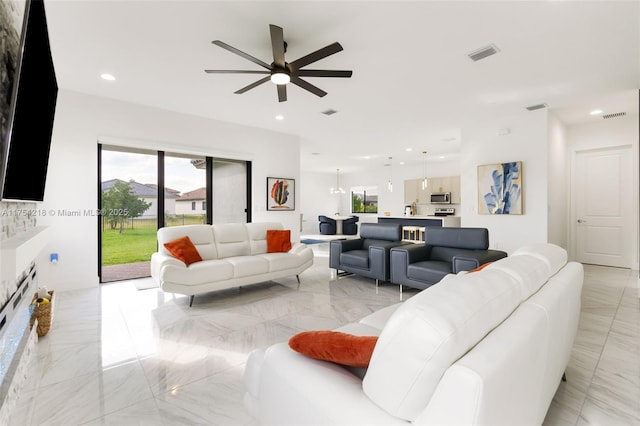 living room featuring marble finish floor, a ceiling fan, visible vents, and recessed lighting