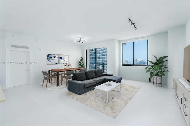 living room with rail lighting and visible vents