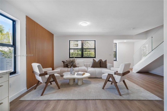 living room featuring baseboards and wood finished floors