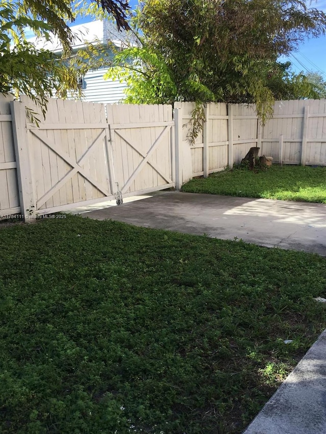 view of yard with a gate and fence