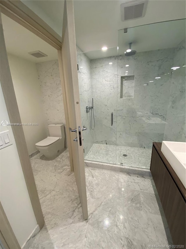 full bathroom with toilet, marble finish floor, a marble finish shower, and visible vents