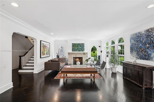 interior space featuring recessed lighting, crown molding, stairway, and baseboards