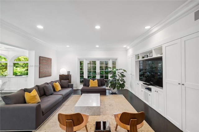 living room with french doors, recessed lighting, and crown molding