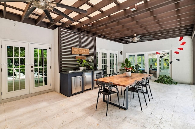 view of patio with ceiling fan, french doors, and outdoor dining area