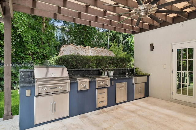 view of patio featuring area for grilling and a pergola