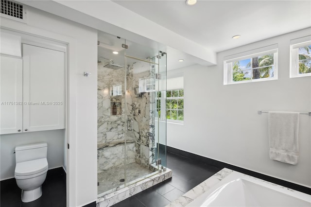 full bath with a marble finish shower, visible vents, baseboards, and toilet