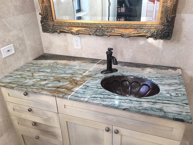 room details with vanity and decorative backsplash