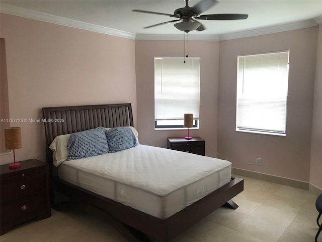 bedroom featuring crown molding, a ceiling fan, and baseboards
