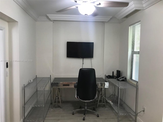 home office featuring crown molding, a ceiling fan, wood finished floors, and baseboards