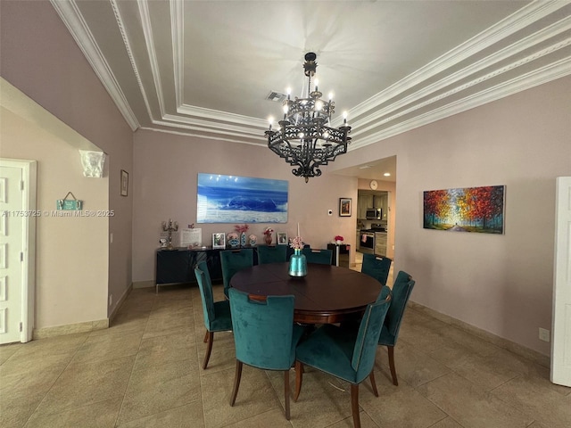 dining area with a notable chandelier, a tray ceiling, visible vents, baseboards, and ornamental molding