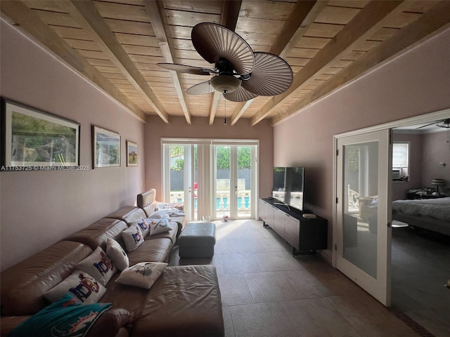 living room featuring ceiling fan, beamed ceiling, and wooden ceiling