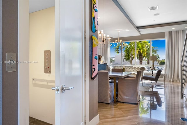 dining area featuring an inviting chandelier and visible vents