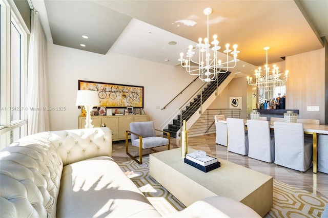 living area with a chandelier, stairway, and recessed lighting