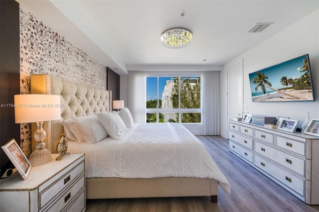 bedroom with wood finished floors