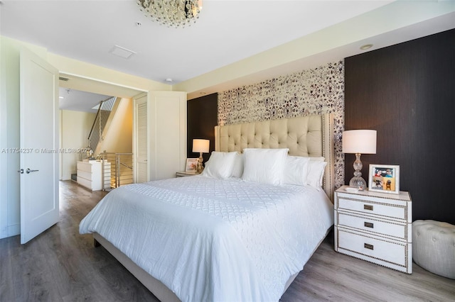 bedroom featuring wood finished floors