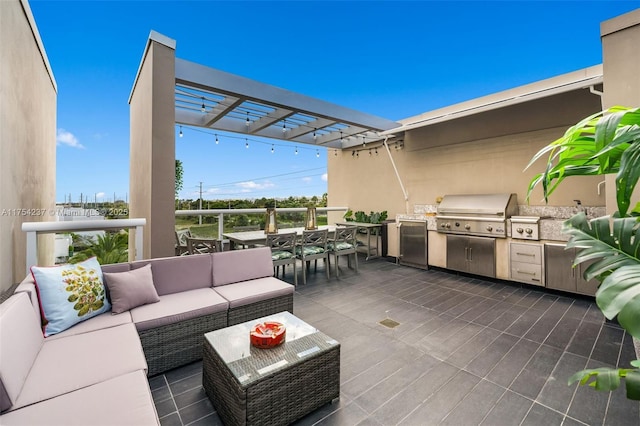 view of patio / terrace with outdoor dining area, outdoor lounge area, an outdoor kitchen, a grill, and a pergola