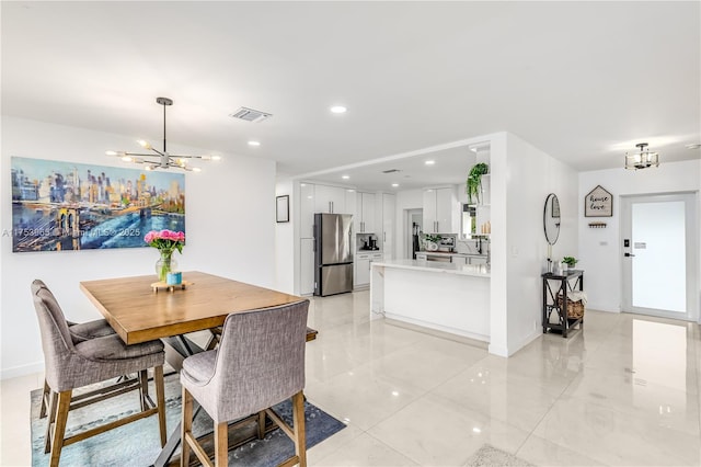 dining room with recessed lighting, visible vents, and an inviting chandelier