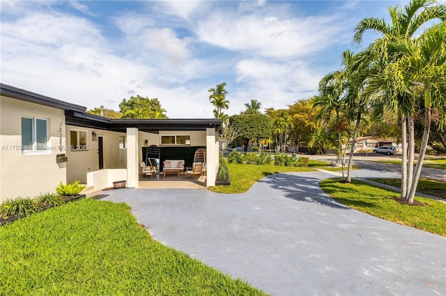 exterior space featuring a patio area and a yard