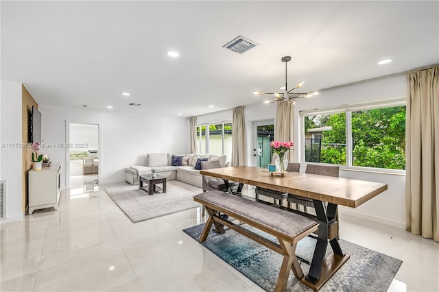 dining room featuring an inviting chandelier, visible vents, and recessed lighting