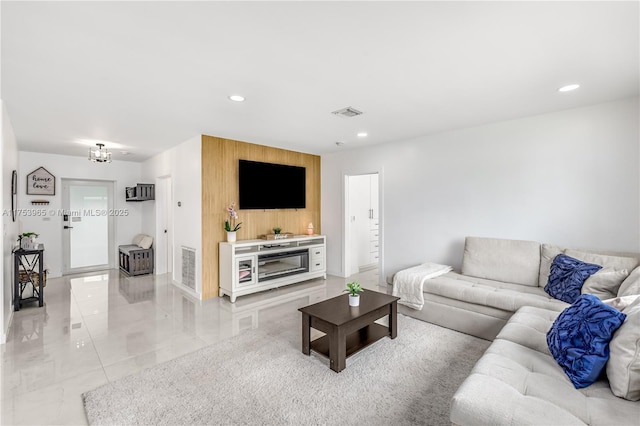 living area with visible vents and recessed lighting