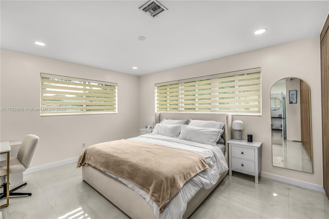 bedroom with visible vents, baseboards, recessed lighting, and arched walkways