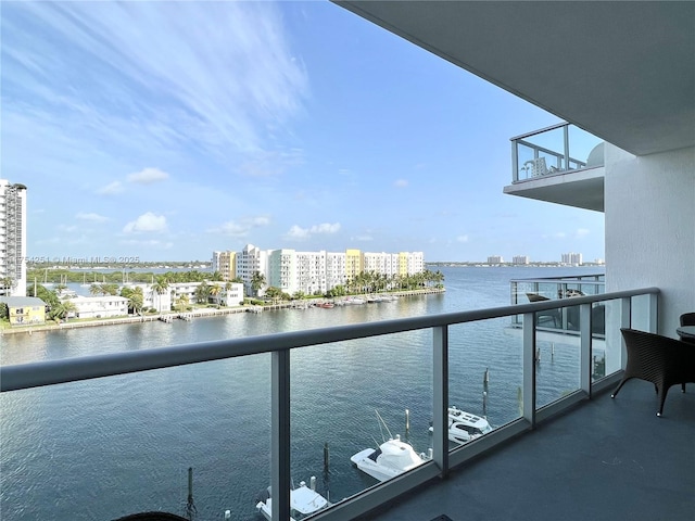 balcony with a city view and a water view