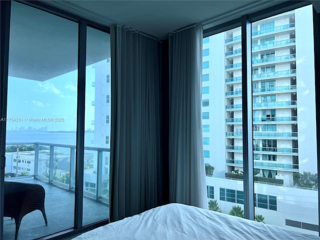 bedroom with visible vents and floor to ceiling windows