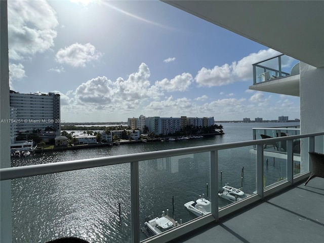 balcony featuring a water view and a view of city