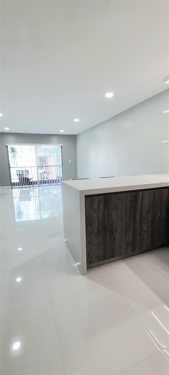 interior space with light tile patterned flooring and recessed lighting