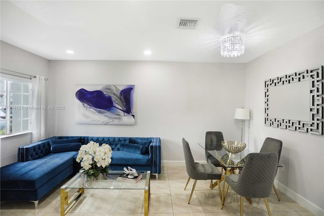 tiled living room with visible vents, baseboards, and recessed lighting