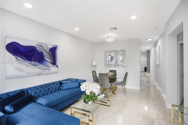 tiled living area with baseboards, visible vents, and recessed lighting