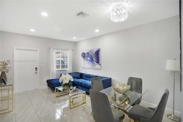 living area featuring light tile patterned floors, recessed lighting, visible vents, baseboards, and an inviting chandelier