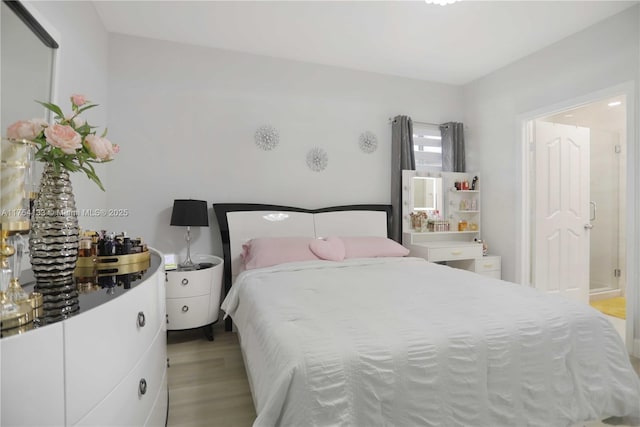 bedroom featuring light wood-style flooring