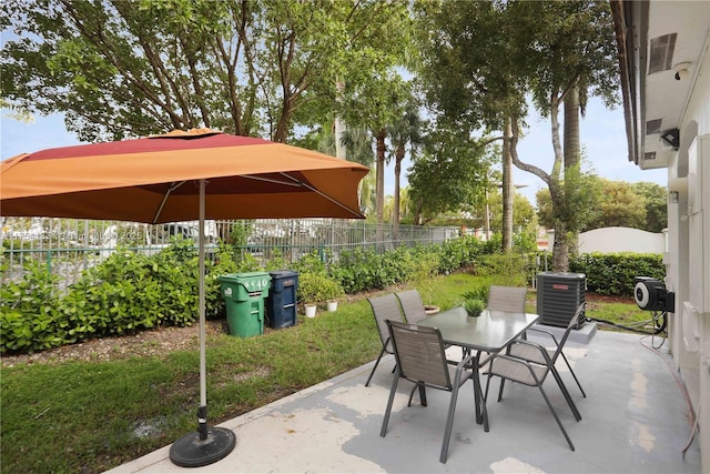 view of patio / terrace with outdoor dining space, cooling unit, and a fenced backyard