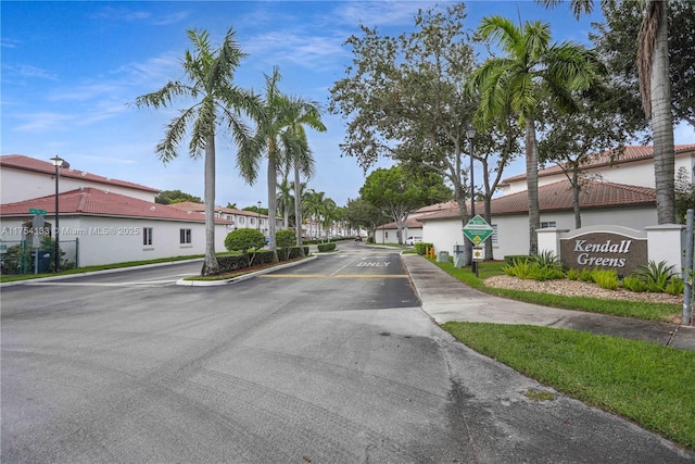 view of street featuring a residential view and street lights