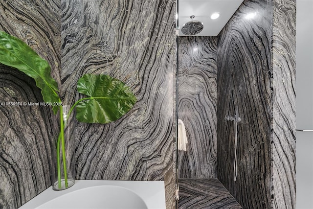 full bath featuring a marble finish shower and a bathing tub