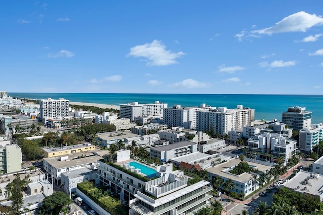 birds eye view of property featuring a water view and a view of city